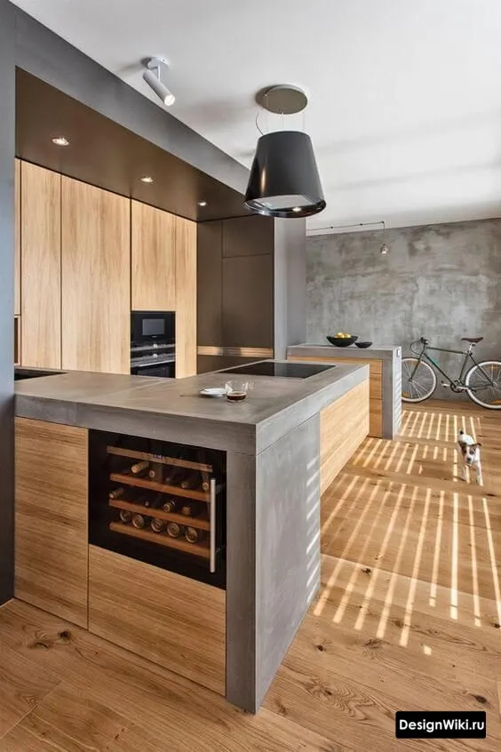 Дизайн кухни в стиле лофт с толстой столешницей из бетона и деревом