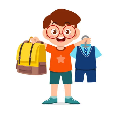 Happy cute little kid boy preparing uniform for school